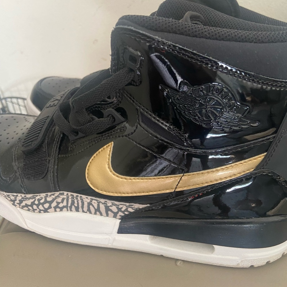 Jordan Black and Gold High-Top Sneakers